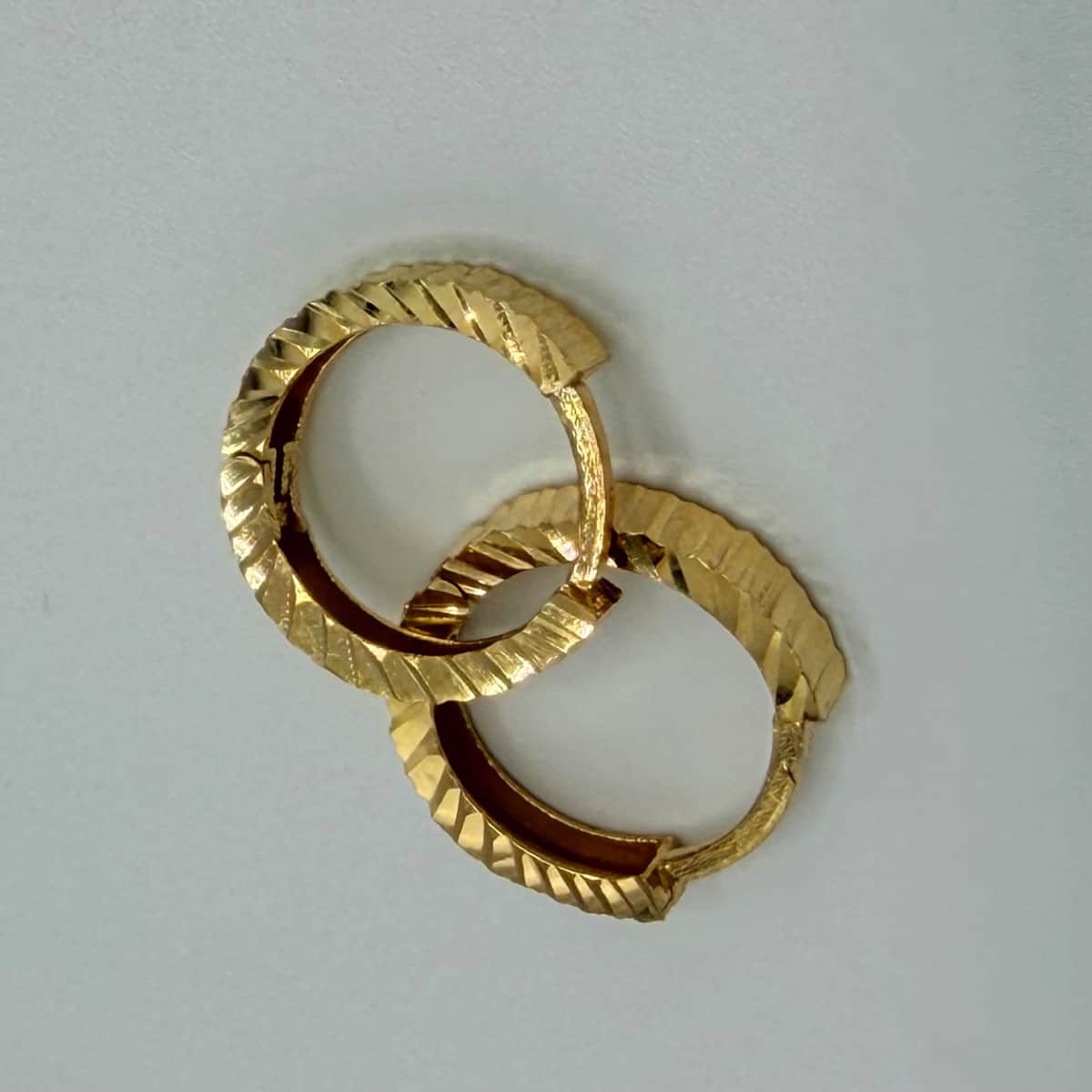 گوشواره طلا 18 عیار حلقه ای تراش وزن 1.100 گرم اجرت ساخت 11 درصد کد GD01 000362